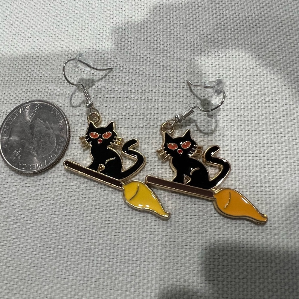 cat on a broom earrings